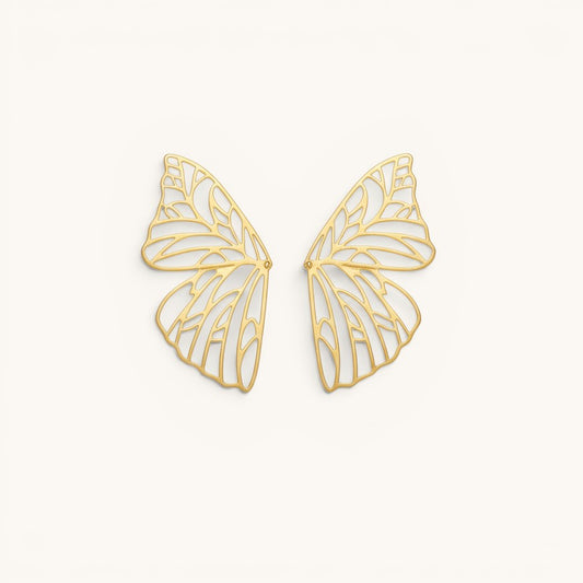 TITLIYA gold-plated butterfly wing hoop earrings with intricate filigree cut-out design on a neutral background.
