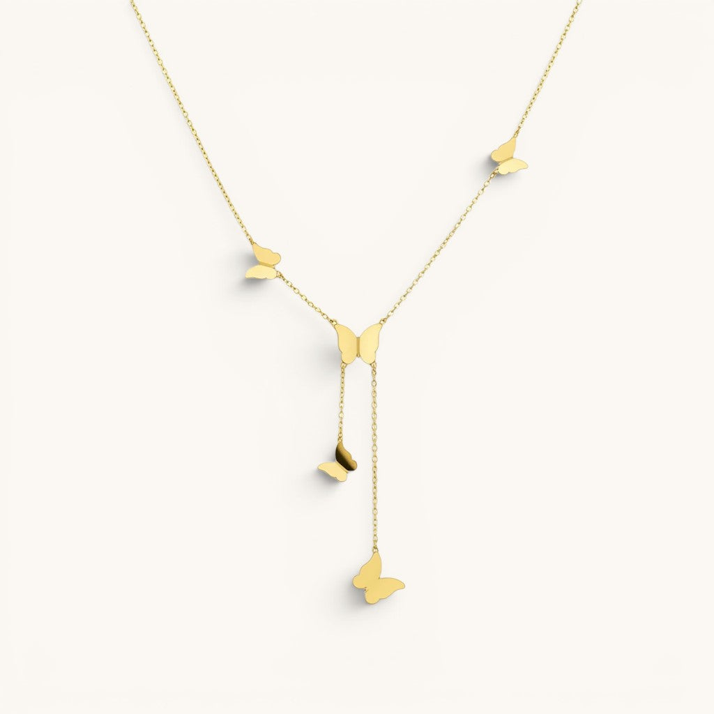 TITLIYA gold glitter butterfly lariat necklace featuring delicate dangling butterfly charms on a fine chain.
