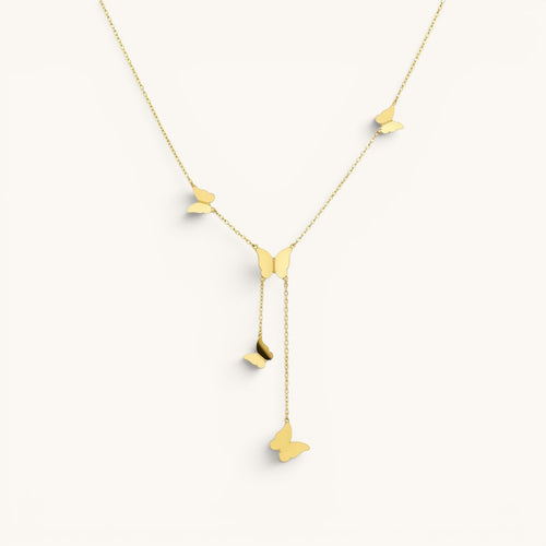 TITLIYA gold glitter butterfly lariat necklace featuring delicate dangling butterfly charms on a fine chain.