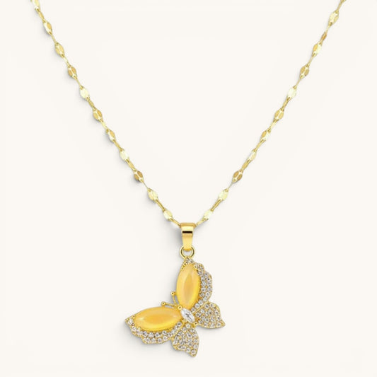 TITLIYA gold-toned butterfly pendant necklace with yellow stone wings and sparkling crystal accents on a delicate chain