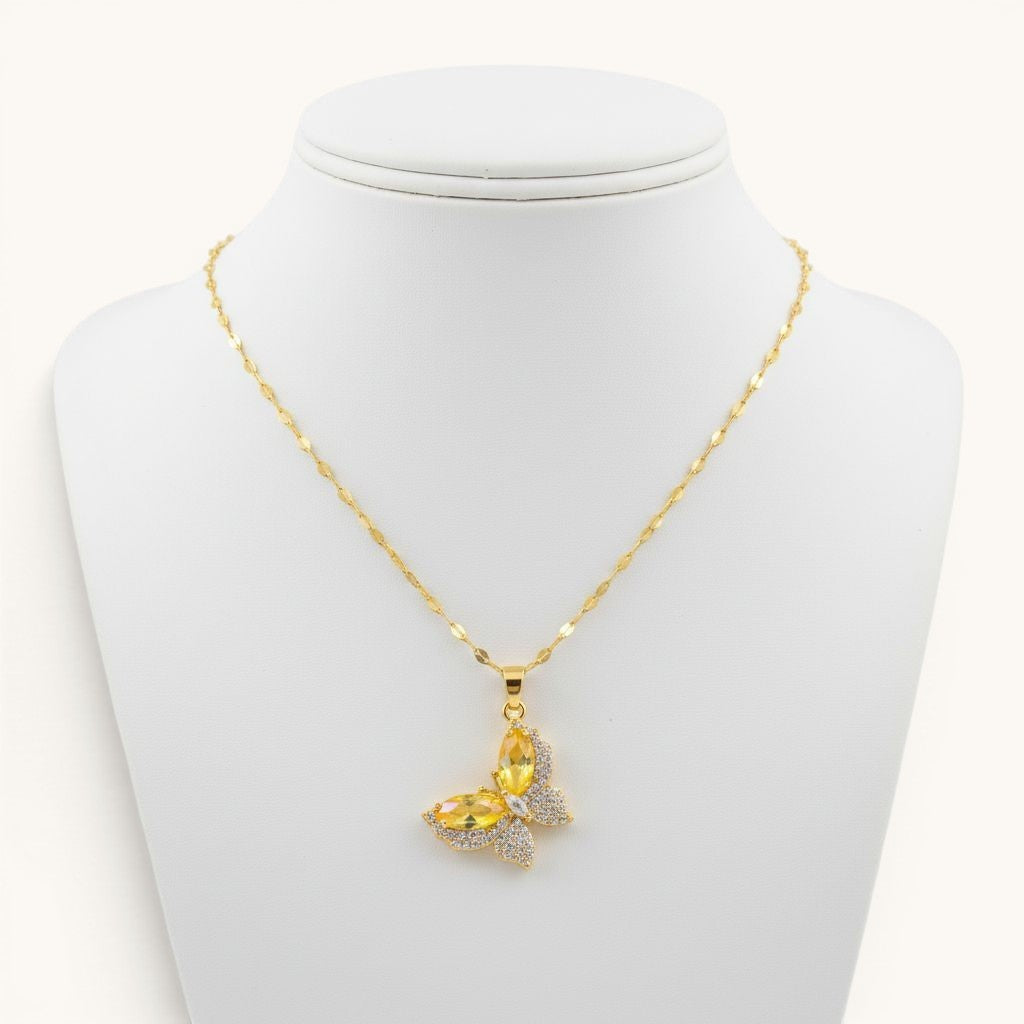 TITLIYA gold-toned butterfly pendant necklace with yellow crystal and sparkling pavé accents on a delicate chain.