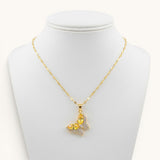 TITLIYA gold-toned butterfly pendant necklace with yellow crystal and sparkling pavé accents on a delicate chain.