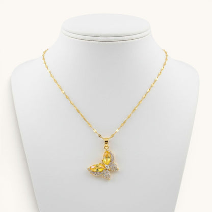 TITLIYA gold-toned butterfly pendant necklace with yellow crystal and sparkling pavé accents on a delicate chain.
