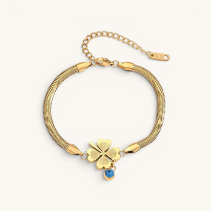 TITLIYA gold-tone snake chain bracelet with a heart-leaf clover charm and a small blue evil eye pendant.