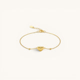 TITLIYA delicate gold heart charm bracelet with dainty bead accents on a fine adjustable chain.