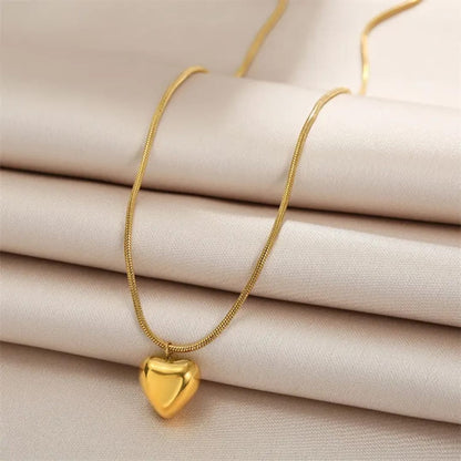 TITLIYA gold-tone heart pendant necklace with a sleek snake chain, perfect for daily wear or elegant gifting.