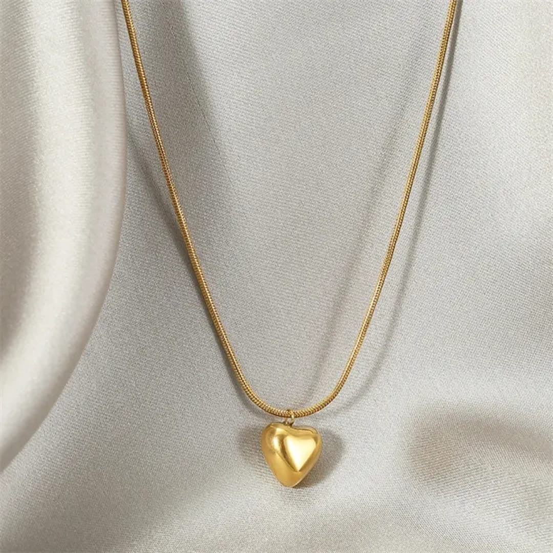 TITLIYA gold-tone heart pendant necklace on a delicate snake chain, perfect for daily wear or elegant gifting.