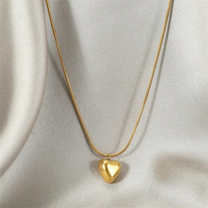 TITLIYA gold-tone heart pendant necklace on a delicate snake chain, perfect for daily wear or elegant gifting.