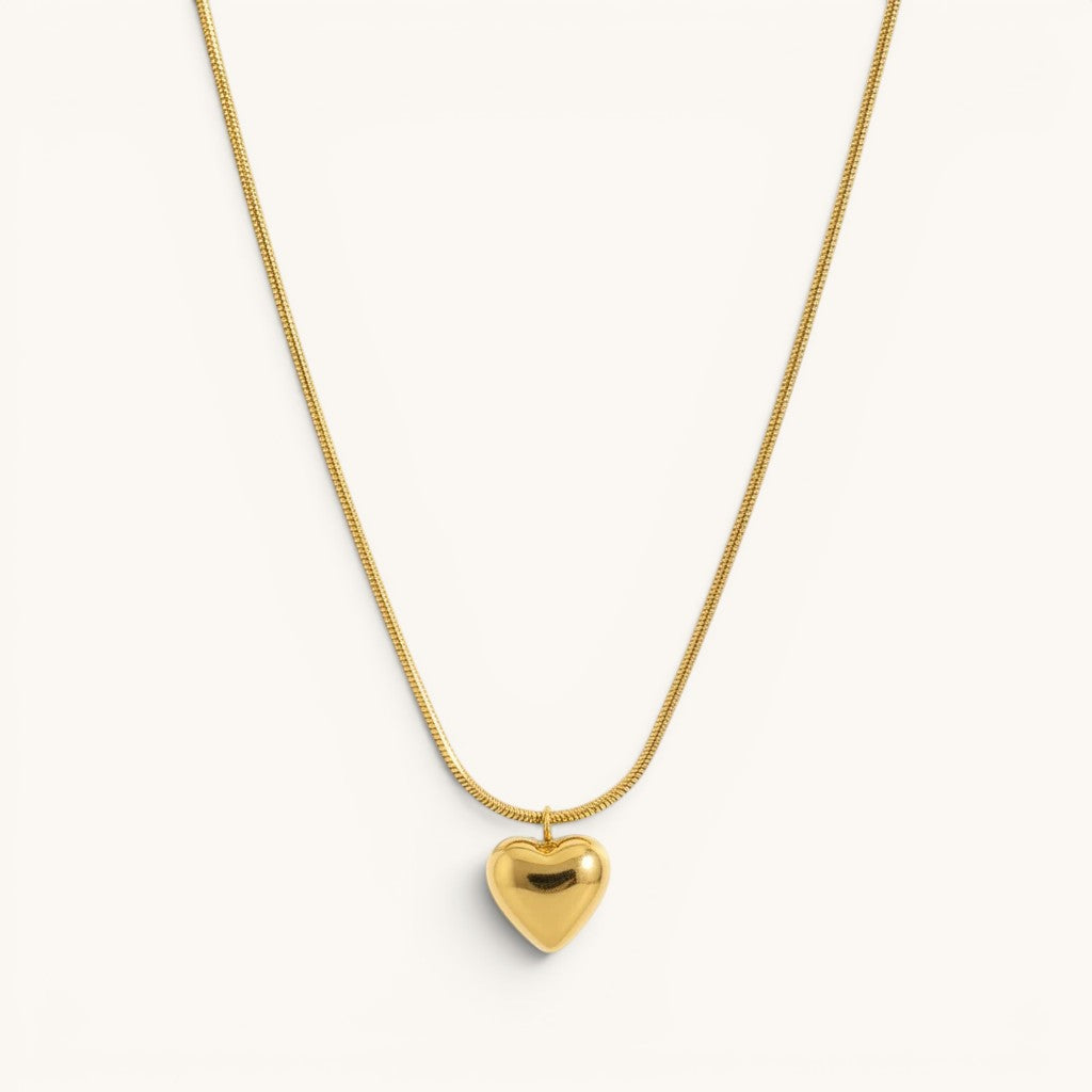 TITLIYA gold-toned heart pendant necklace on a sleek snake chain, perfect for everyday elegant wear.