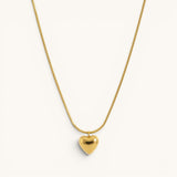 TITLIYA gold-toned heart pendant necklace on a sleek snake chain, perfect for everyday elegant wear.