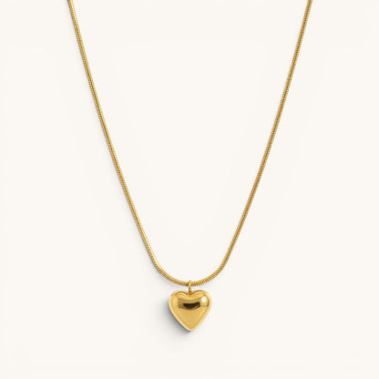 TITLIYA gold-toned heart pendant necklace on a sleek snake chain, perfect for everyday elegant wear.