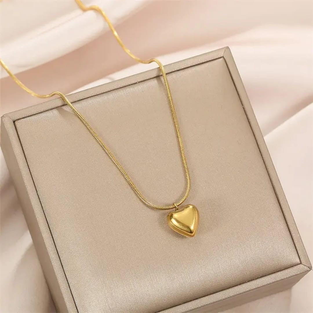 TITLIYA gold-tone heart pendant necklace on a delicate snake chain, presented in a luxury gift box.