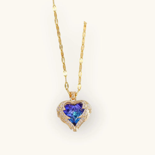 TITLIYA gold-plated necklace featuring a blue heart-shaped crystal pendant with angel wing accents and clear stones.