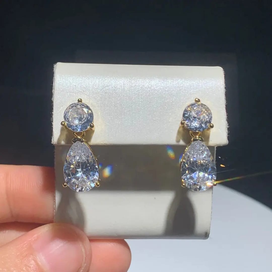 TITLIYA gold-plated drop earrings featuring round and pear-cut sparkling white diamonds for elegant daily wear.