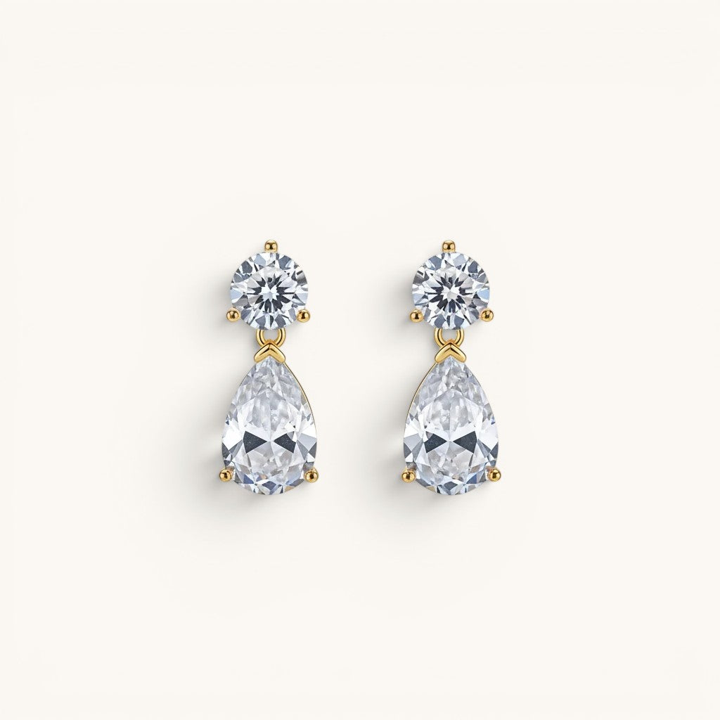 TITLIYA gold-plated drop earrings featuring a round stud and pear-cut clear stone for elegant daily wear.