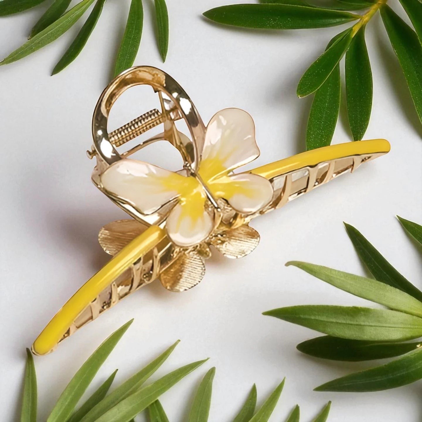 TITLIYA gold-tone butterfly hair claw clip with yellow enamel wings, perfect for a secure and stylish hairstyle.