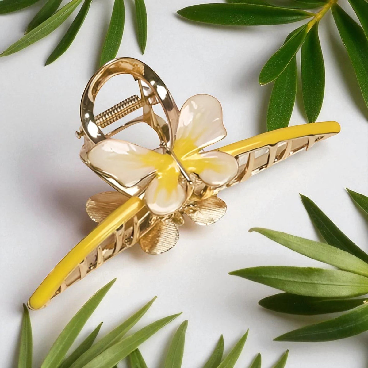 TITLIYA gold-tone butterfly hair claw clip with yellow enamel wings, perfect for a secure and stylish hairstyle.