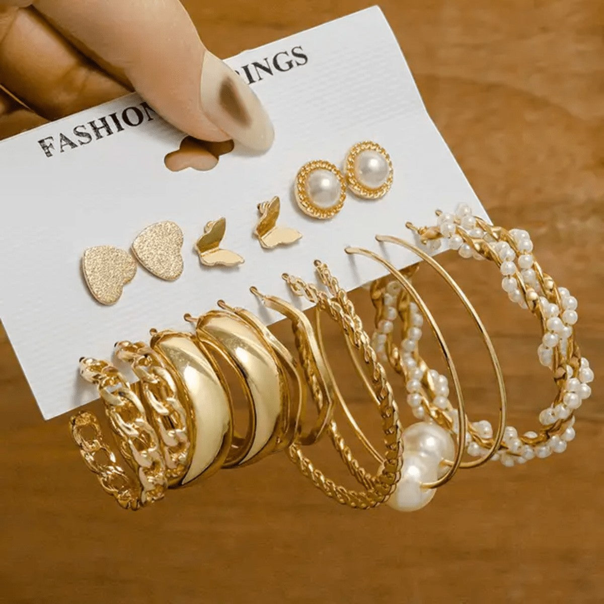 TITLIYA set of 9 golden Korean earrings featuring hoops, pearls, butterfly, and heart designs for daily wear.