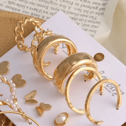 TITLIYA set of 9 golden Korean earrings featuring hoop, chain, and pearl designs for daily wear and gifting.
