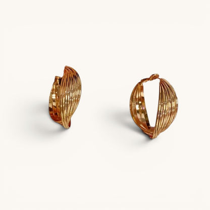 TITLIYA golden twisted hoop earrings with a polished ribbed design for elegant daily wear.