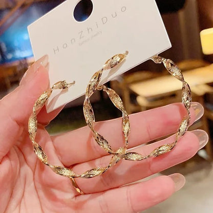 TITLIYA golden round hoop earrings with a textured twisted design for elegant daily wear.