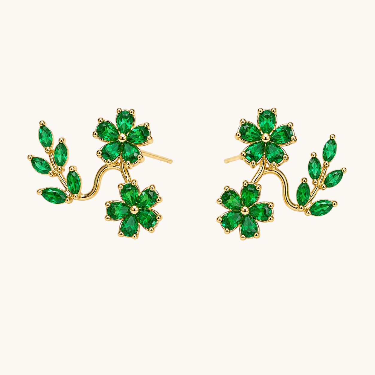 TITLIYA gold-tone Korean stud earrings featuring green crystal leaf and flower designs for elegant daily wear.