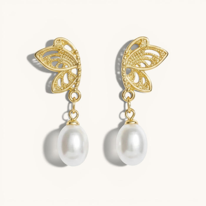 TITLIYA gold-tone half butterfly stud earrings with elegant dangling white pearls for a chic, premium look.