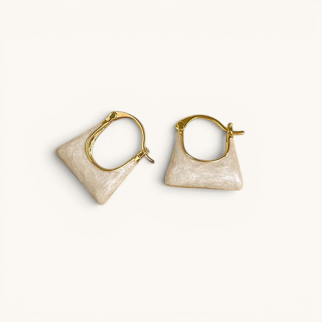 TITLIYA gold-tone hoop earrings featuring a unique cream-colored handbag-shaped charm for a stylish everyday look.