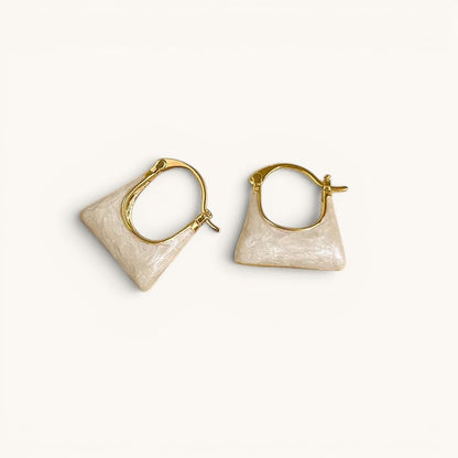 TITLIYA gold-tone hoop earrings featuring a unique cream-colored handbag-shaped charm for a stylish everyday look.