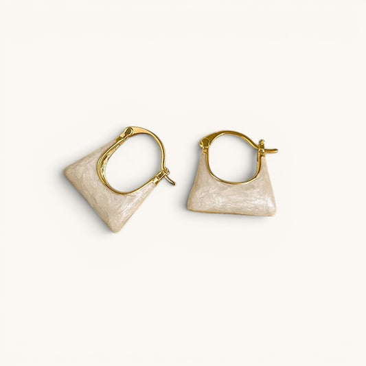 TITLIYA gold-tone hoop earrings featuring a unique cream-colored handbag-shaped charm for a stylish everyday look.