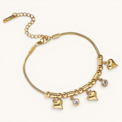 TITLIYA gold-tone bracelet with heart charms and clear stone accents on a delicate snake chain with extender.