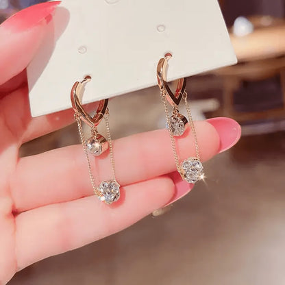 TITLIYA Korean-style rose gold hanging earrings with sparkling diamond-like crystals on delicate chains.