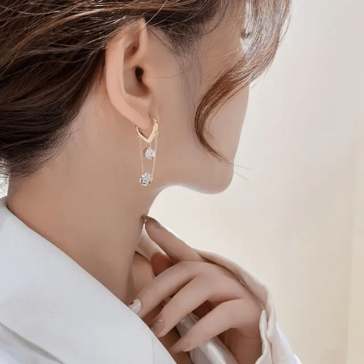 TITLIYA Korean diamond hanging earrings featuring delicate gold chains and sparkling stones worn by a woman