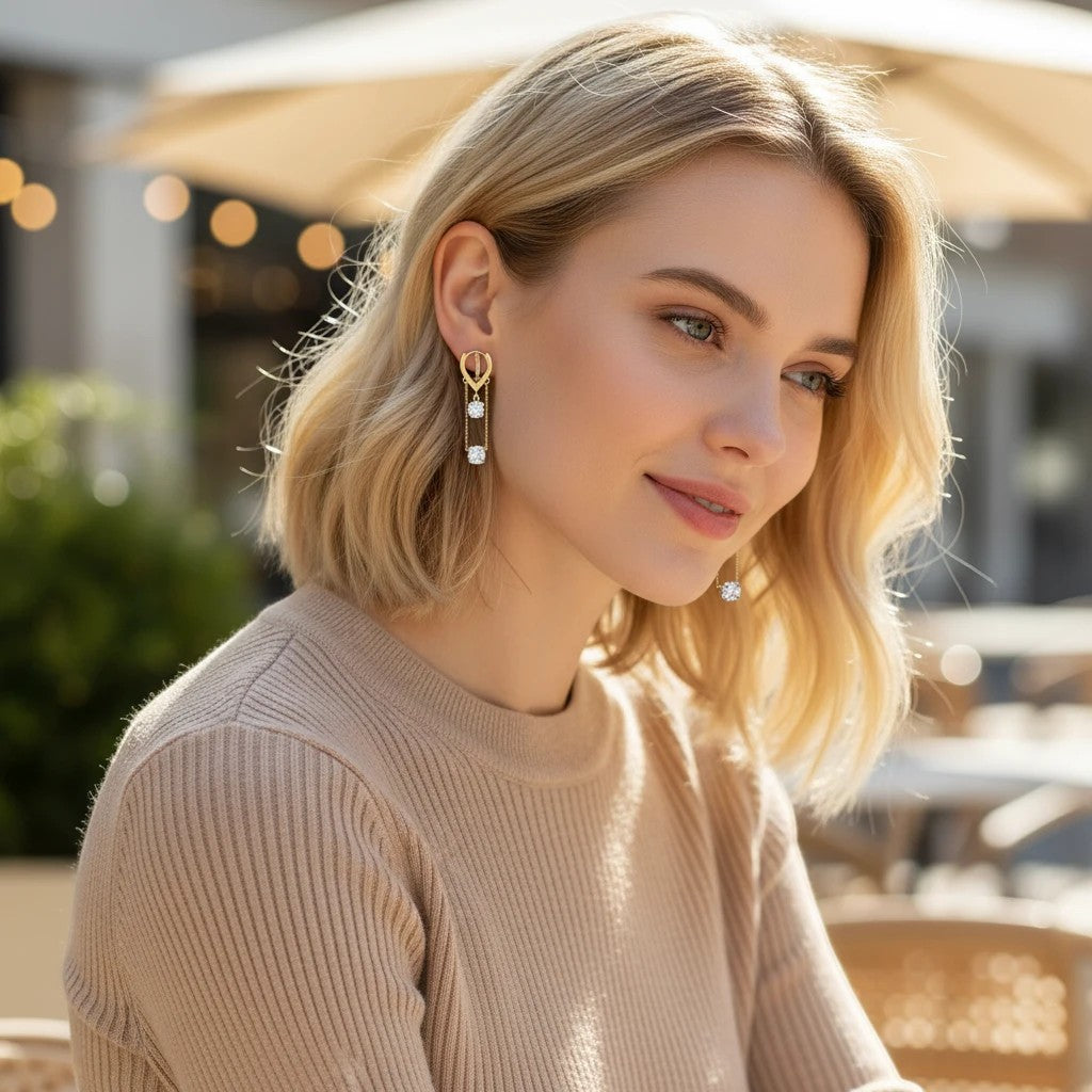 Blonde woman wearing elegant TITLIYA Korean diamond hanging earrings with gold-tone chains for a stylish daily look.