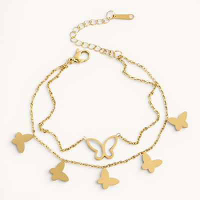 TITLIYA gold-toned layered chain bracelet featuring delicate butterfly charms and a white inlay butterfly detail.