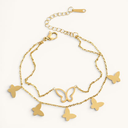 TITLIYA gold-toned layered chain bracelet featuring delicate butterfly charms and a white inlay butterfly detail.