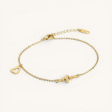 TITLIYA gold-tone adjustable 2-in-1 bracelet and anklet featuring a heartbeat motif and a delicate open-heart charm.
