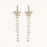TITLIYA long gold butterfly earrings with crystal pavé, pink accents, and dangling beaded tassel chains.