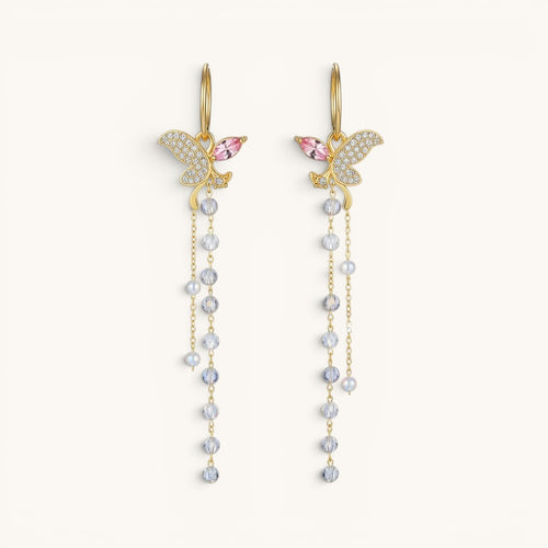 TITLIYA long gold butterfly earrings with crystal pavé, pink accents, and dangling beaded tassel chains.