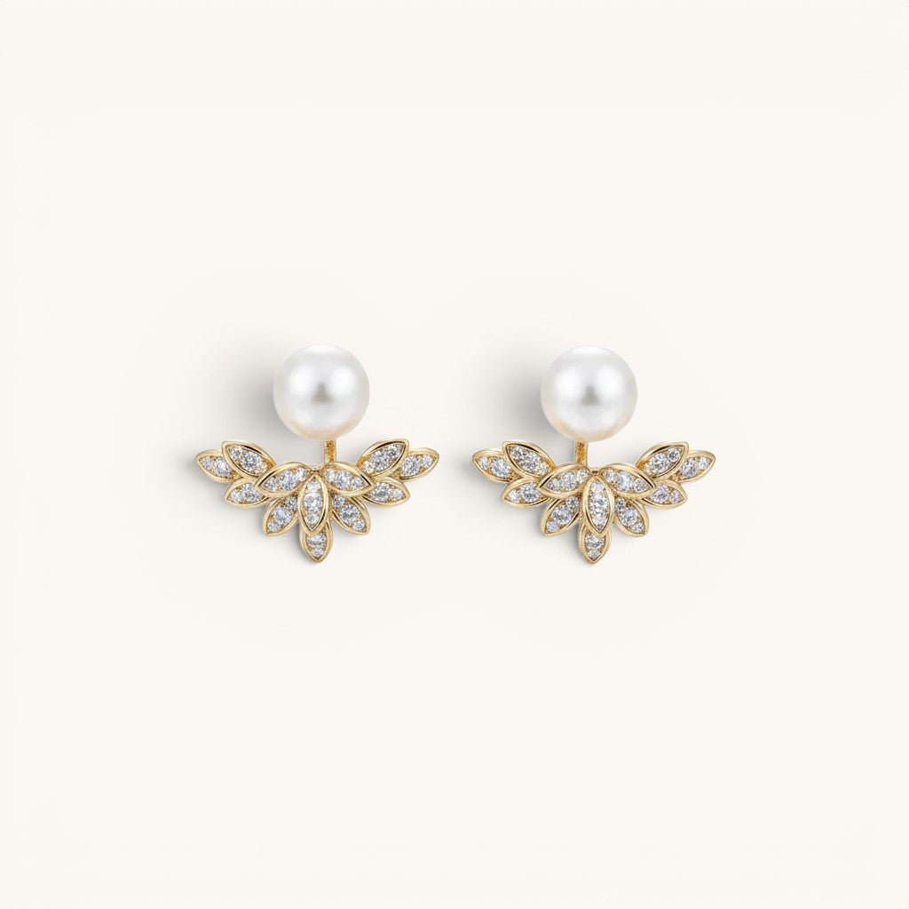 TITLIYA gold-tone pear leaf Korean stud earrings featuring white pearls and sparkling crystal accents.