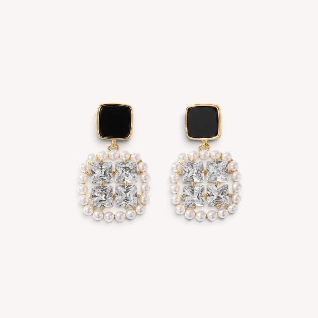 TITLIYA premium square earrings featuring black studs, clear crystals, and a delicate pearl border in gold-tone metal.