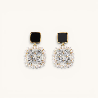 TITLIYA premium square earrings featuring black studs, clear crystals, and a delicate pearl border in gold-tone metal.
