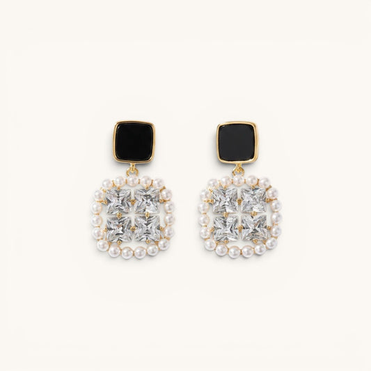 TITLIYA premium square earrings featuring black studs, clear crystals, and a delicate pearl border in gold-tone metal.