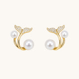 TITLIYA gold-tone whale tail earrings featuring white pearls and sparkling cubic zirconia accents.