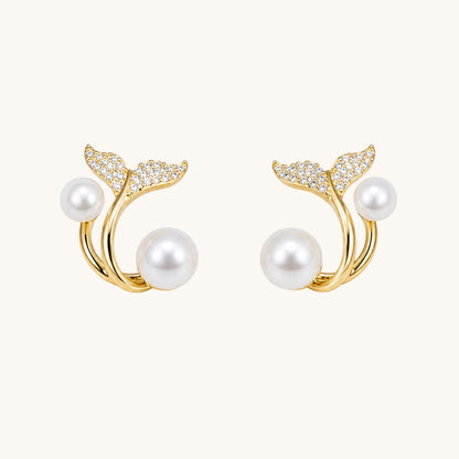 TITLIYA gold-tone whale tail earrings featuring white pearls and sparkling cubic zirconia accents.
