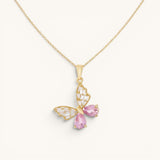 TITLIYA gold butterfly pendant necklace featuring pink teardrop crystals and clear baguette stones on a delicate chain.