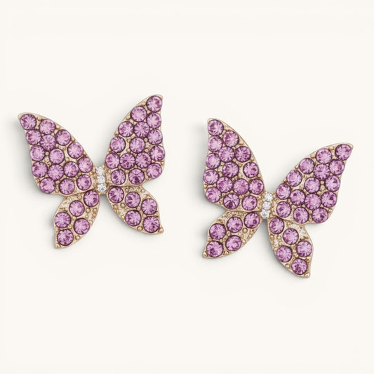 TITLIYA pink butterfly stud earrings with sparkling crystal embellishments on a gold-tone finish for daily wear.