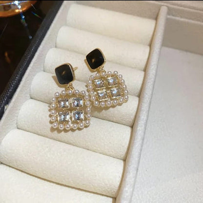 TITLIYA premium square earrings featuring black studs, clear crystals, and a pearl-encrusted border for elegant wear.