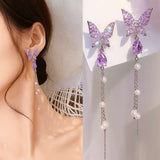 TITLIYA purple butterfly Korean-style drop earrings with dangling pearls and silver chains worn by a model.