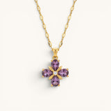 TITLIYA gold necklace featuring a purple stone flower pendant with four teardrop petals and a central diamond accent.